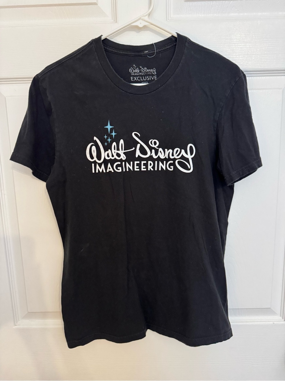 Disney Black Walt Disney Imagineering Logo Tee with White Script and Blue Stars